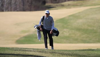 Julien Babineau with his golf clubs