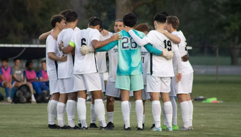 Men's soccer huddle