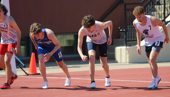Lucas Naugle on starting line in outdoor track