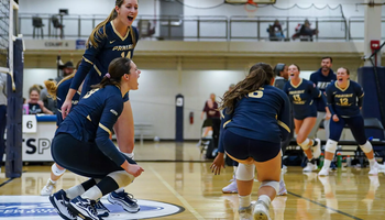 UIS volleyball team celebration