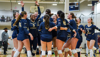 UIS volleyball team celebration