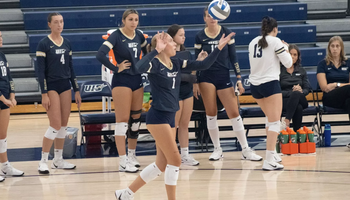 Madeline Mendelblatt serving the ball 