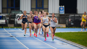 Lillian Buzani and Camille Terre running outdoor track
