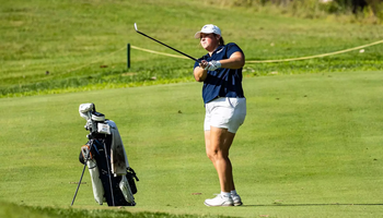 Isabelle Segal golfing