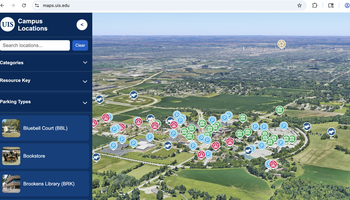 Interactive campus map covered with location markers, showing greenery and city in background