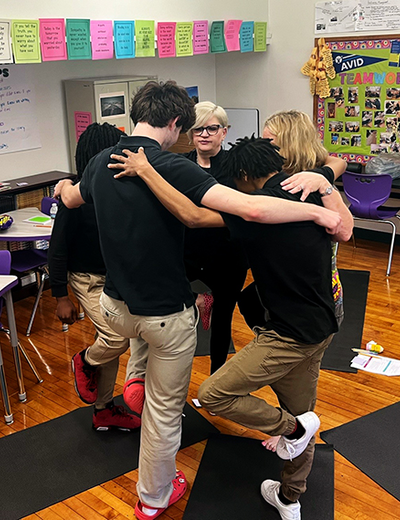 Jennifer Martin teaches students yoga