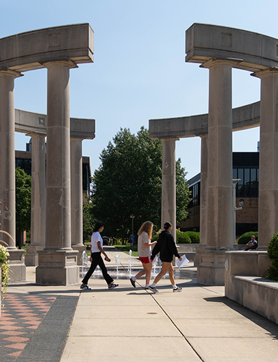 Students walk through the colonnade at the University of Illinois Springfield.