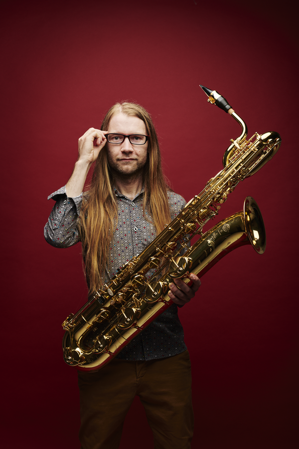 Photograph of a man holding the saxophone