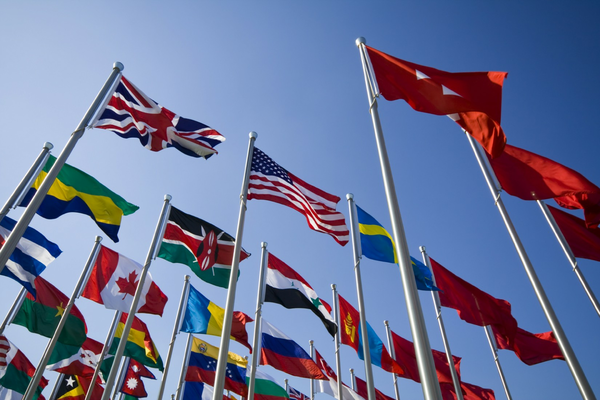 Different country's flags flying in the sky