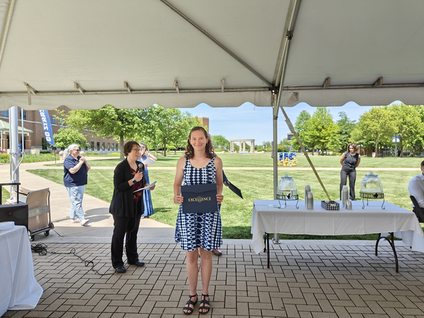 Anna Schurz receiving award