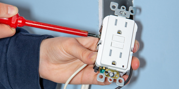 Person working on an outlet
