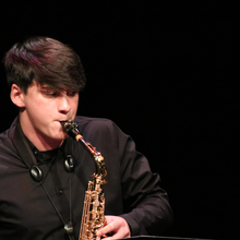 Jazz performer playing the saxophone