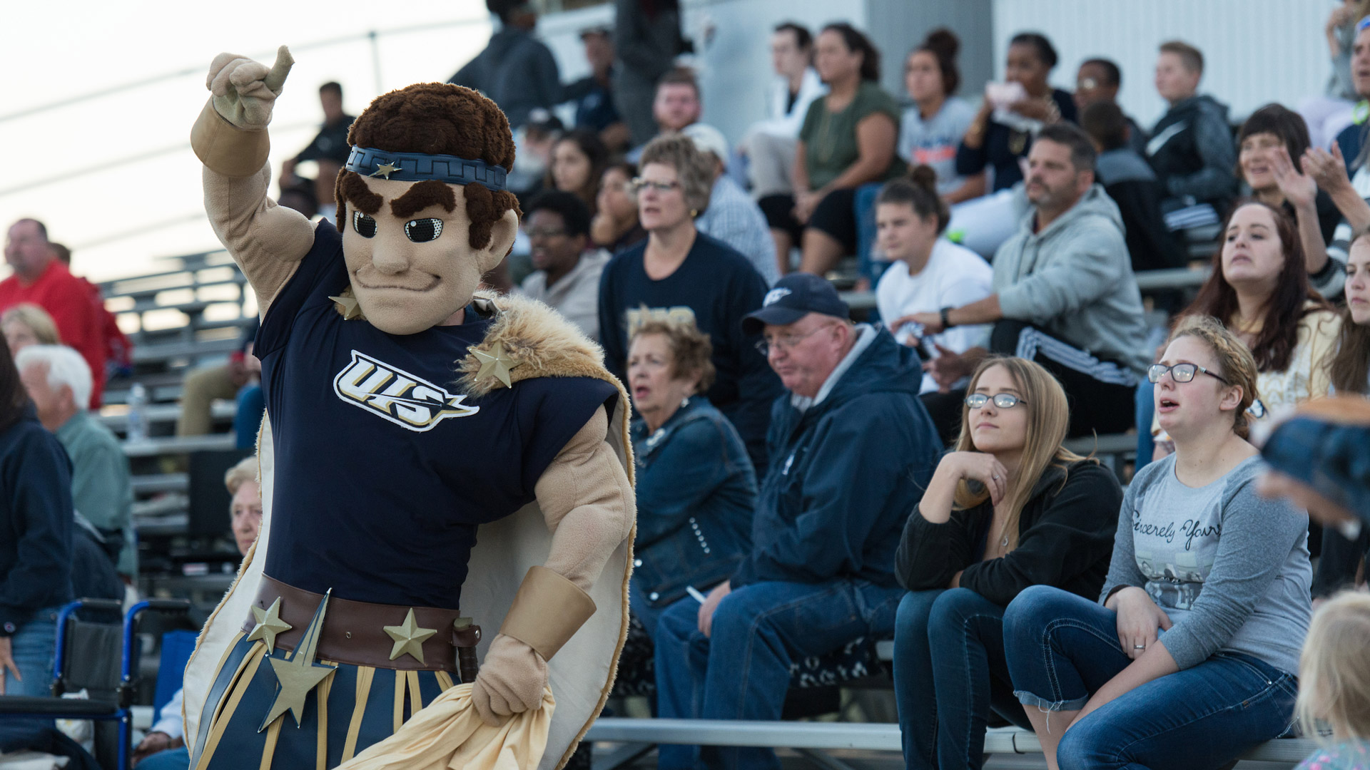 Orion the UIS mascot cheering on from the stands at a soccer game