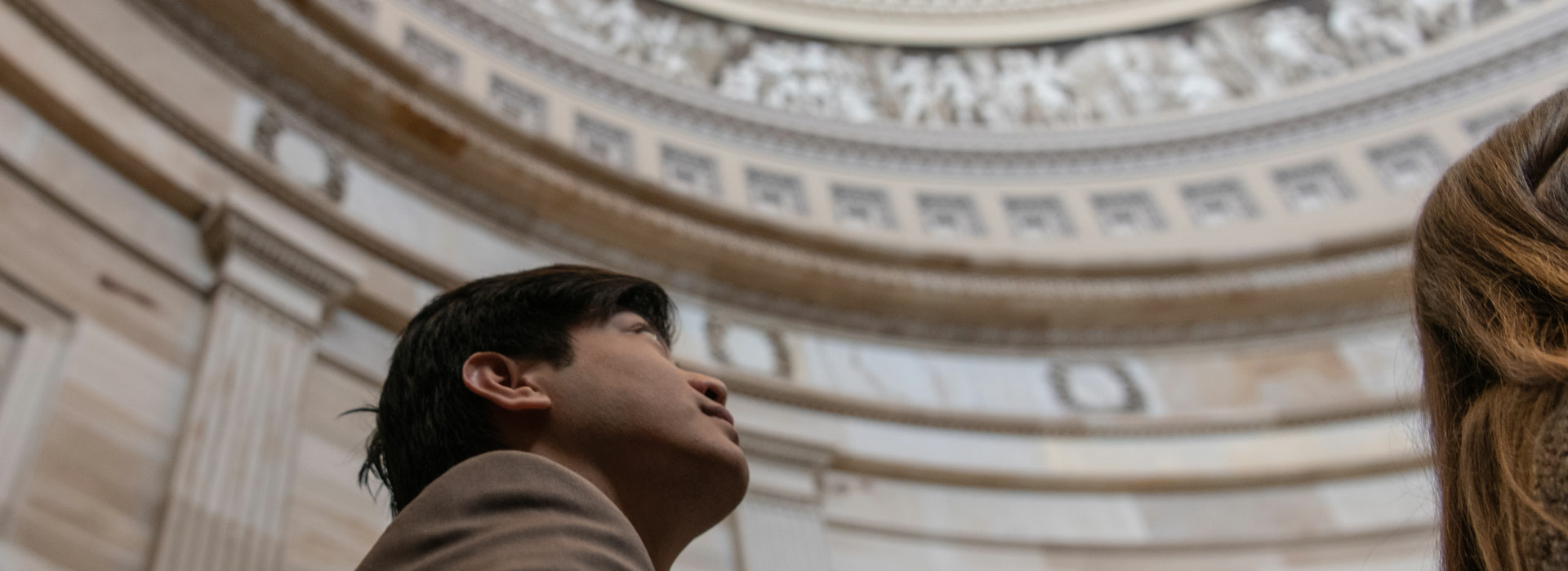 a person looking up into the dome of the Illinois Capitol Building