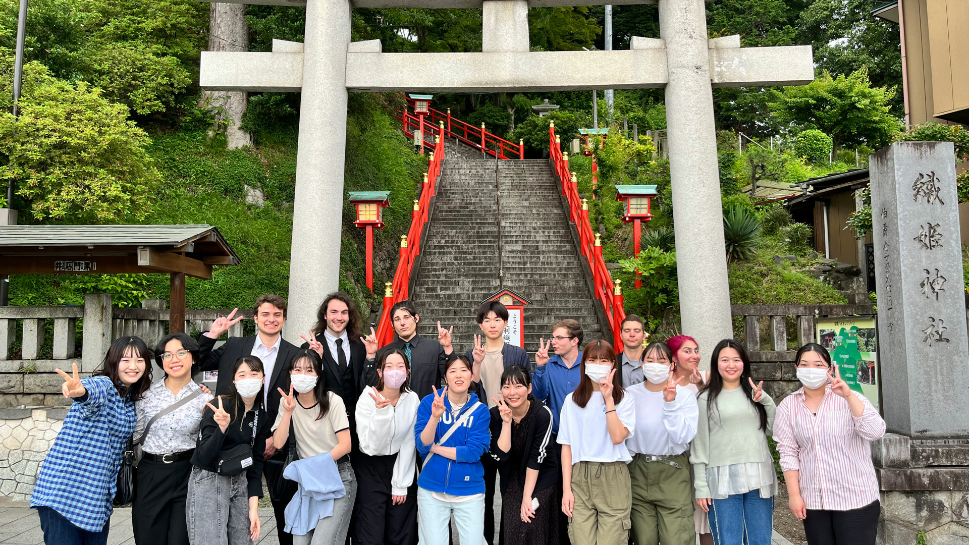 students standing in front of a Japanese temple