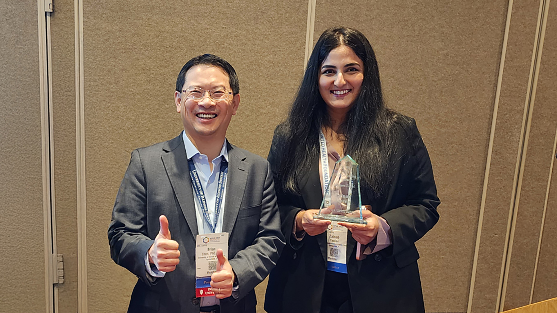 Brian Chen and Zainab Yaseen pose with the award.