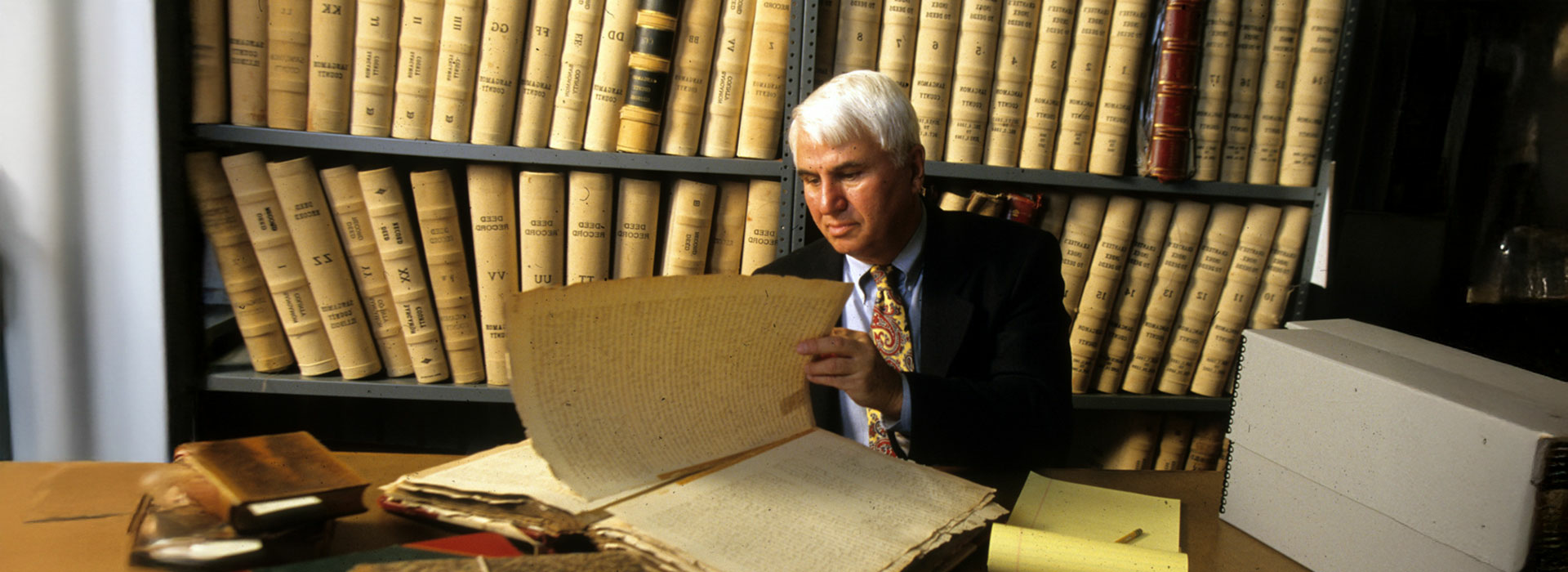 professor in front of books