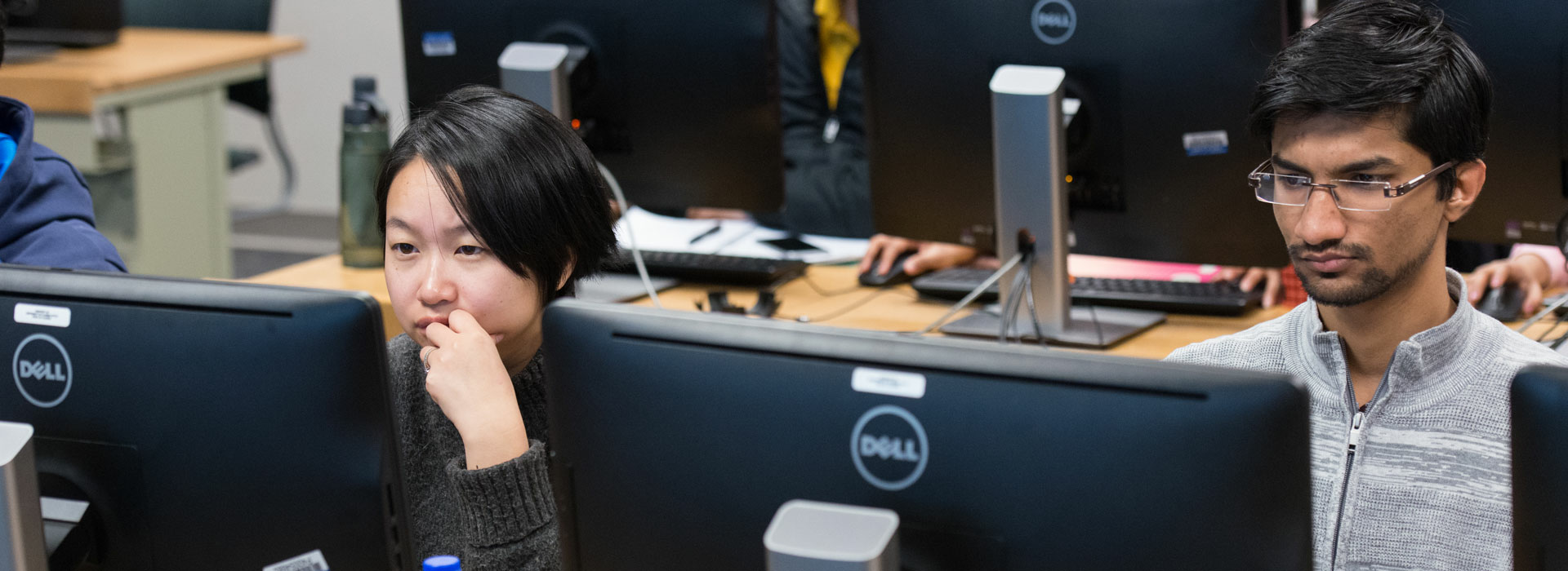 two students looking at their computers