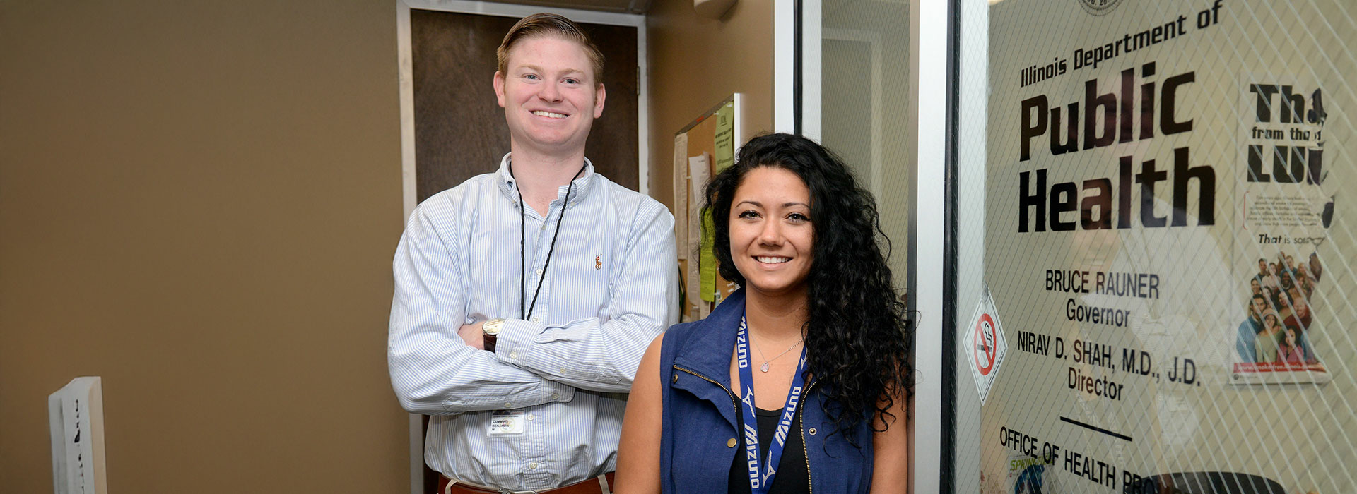 students in front of public health sign